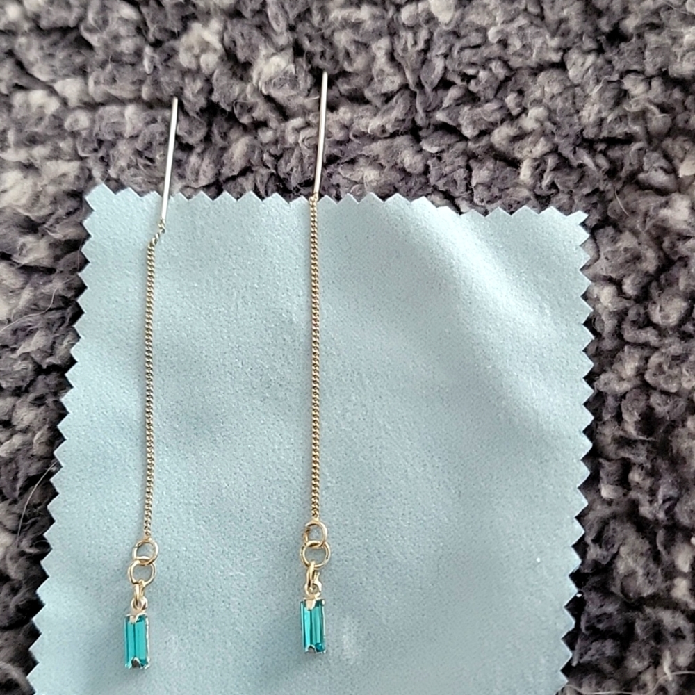 Sterling silver long dangle earrings with aquamarine glass stone.